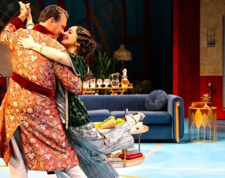 Photo of two leads of private lives at alley theatre dancing on stage