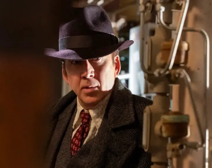 man in a fedora and 40s era suit