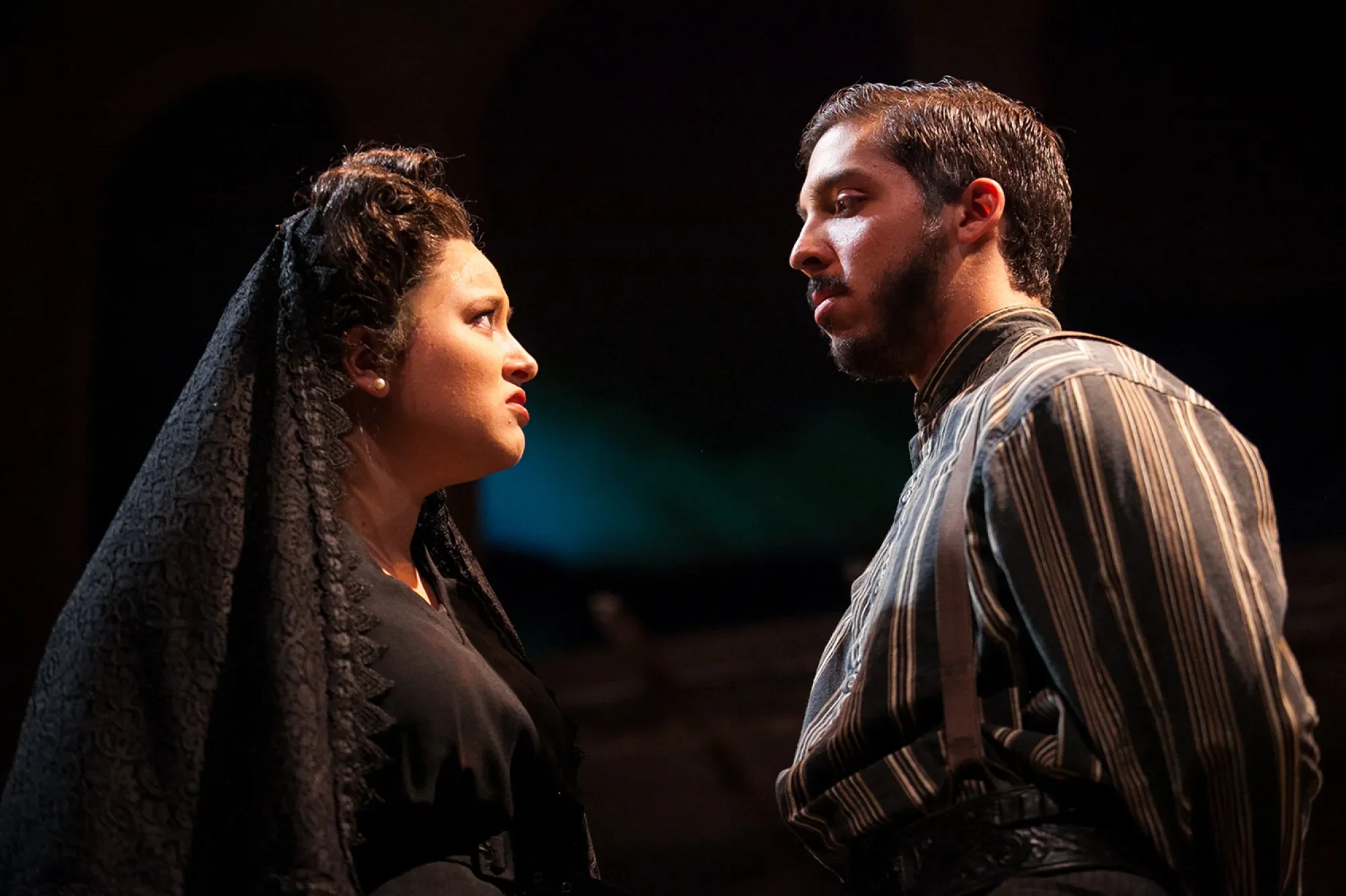 man and woman looking at each other angrily