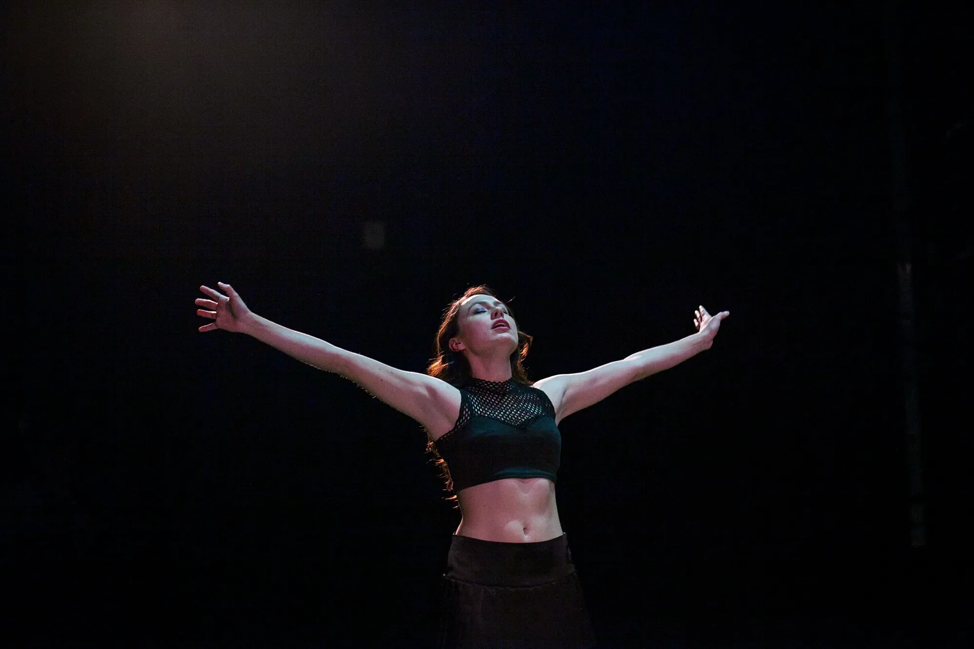 woman with arms outstretched
