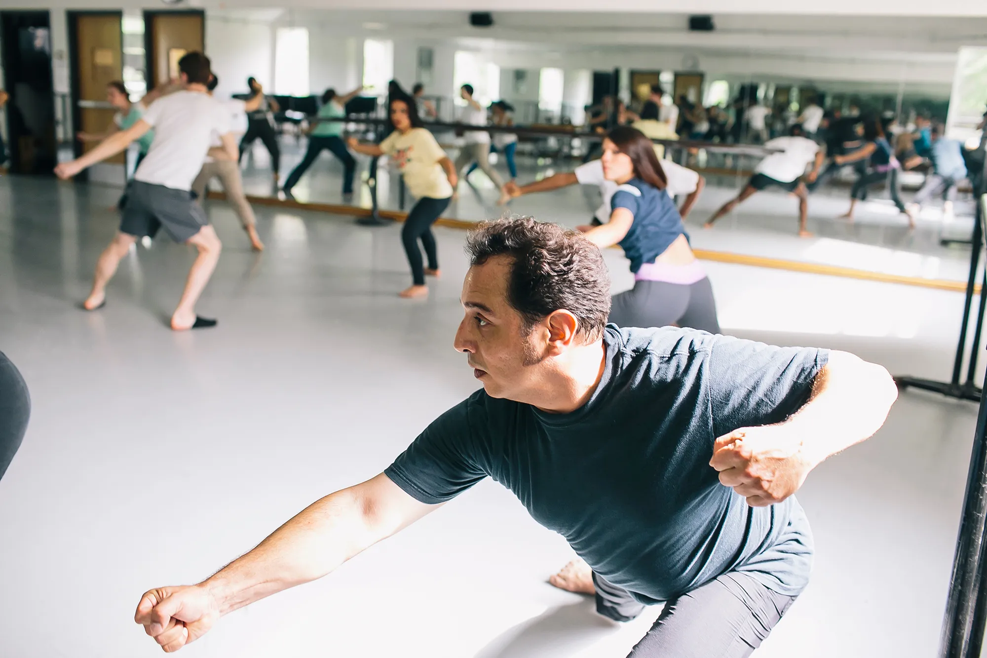 dancers with arm extended
