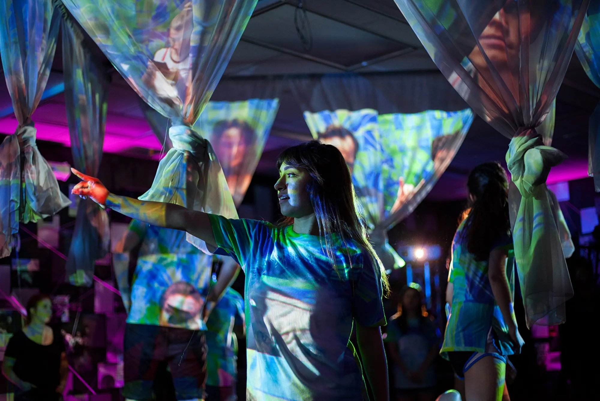 TITLE LOADING; Photo: Lawrence Peart person speaking with projections