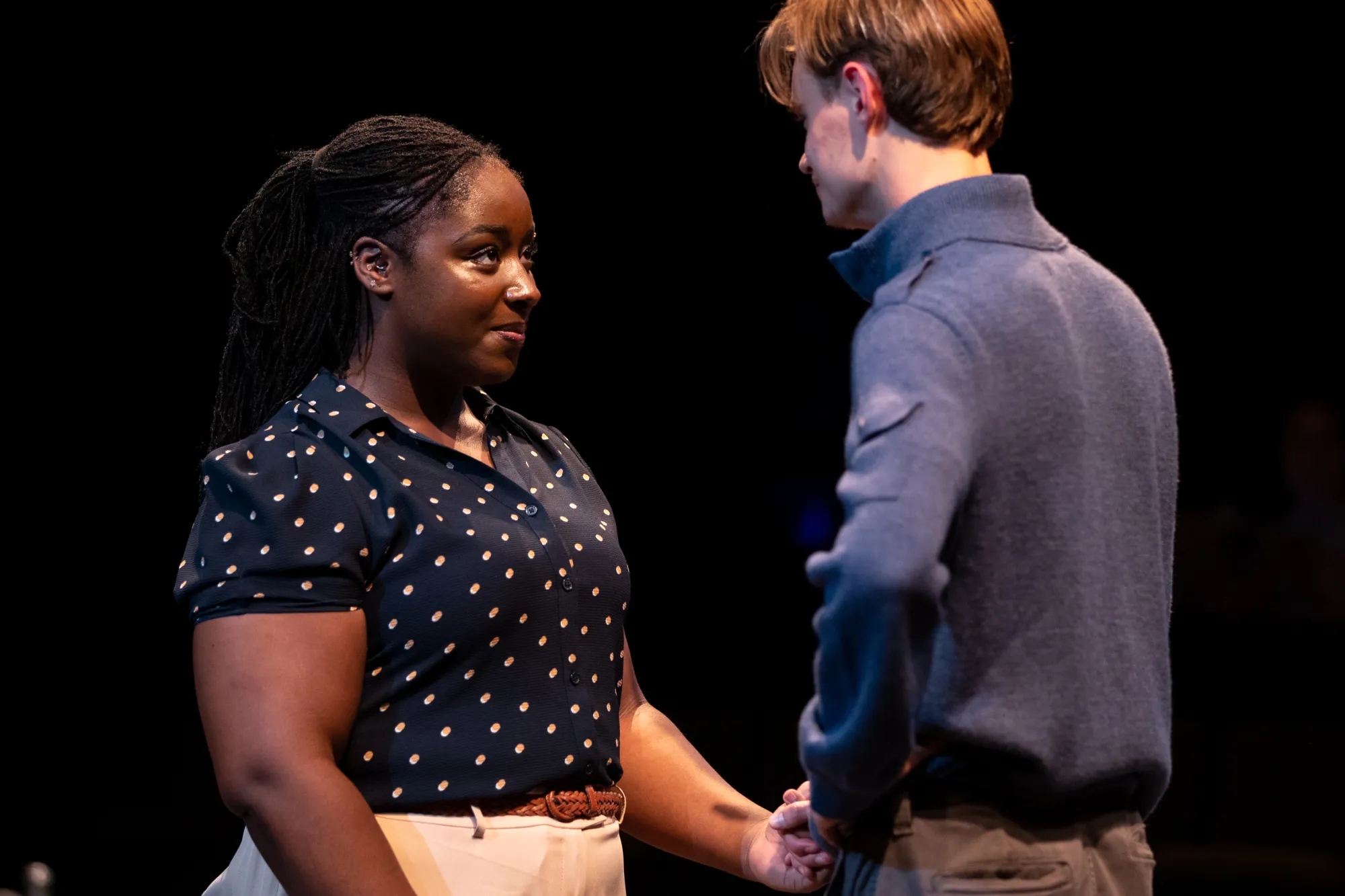 Shalom Onuorah as Jen and Oliver Aaro as Arthur share a sweet moment facing each other.