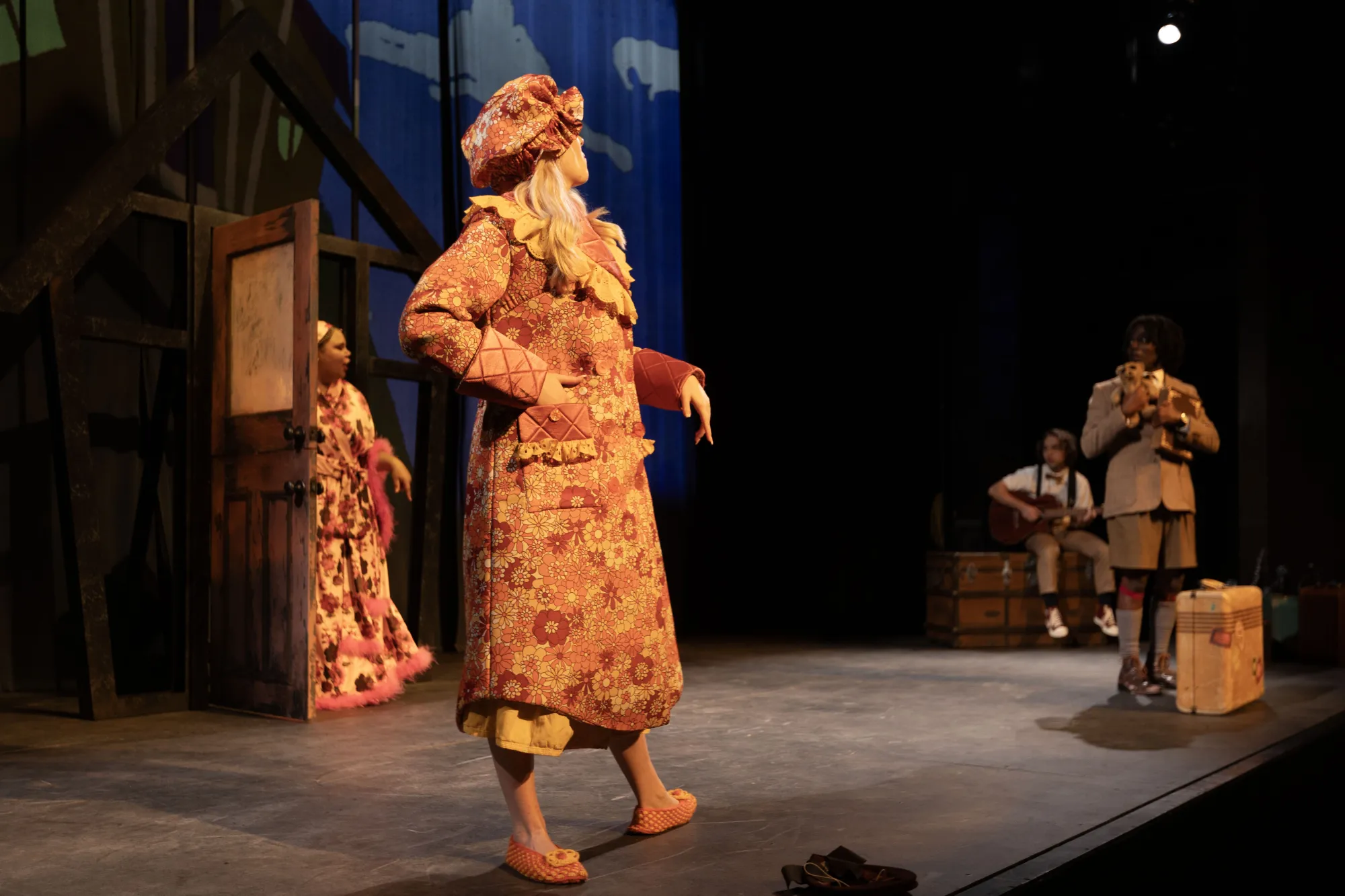 James, played by Trevor Gatabaki, is cowering at the sight of his two aunts, Aunt Spiker and Aunt Sponge, played by Ella Scoresby and Sereniti Patterson respectively