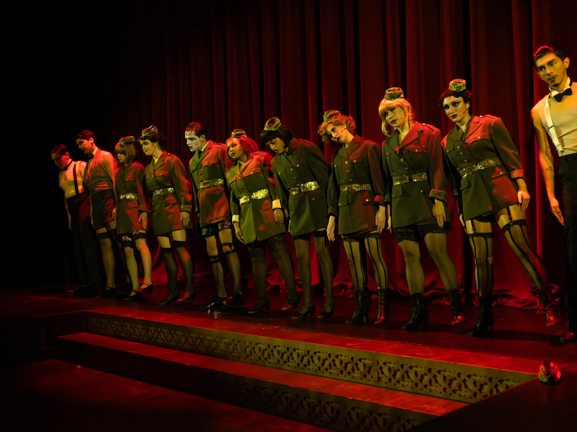 A line of people in military coats marching