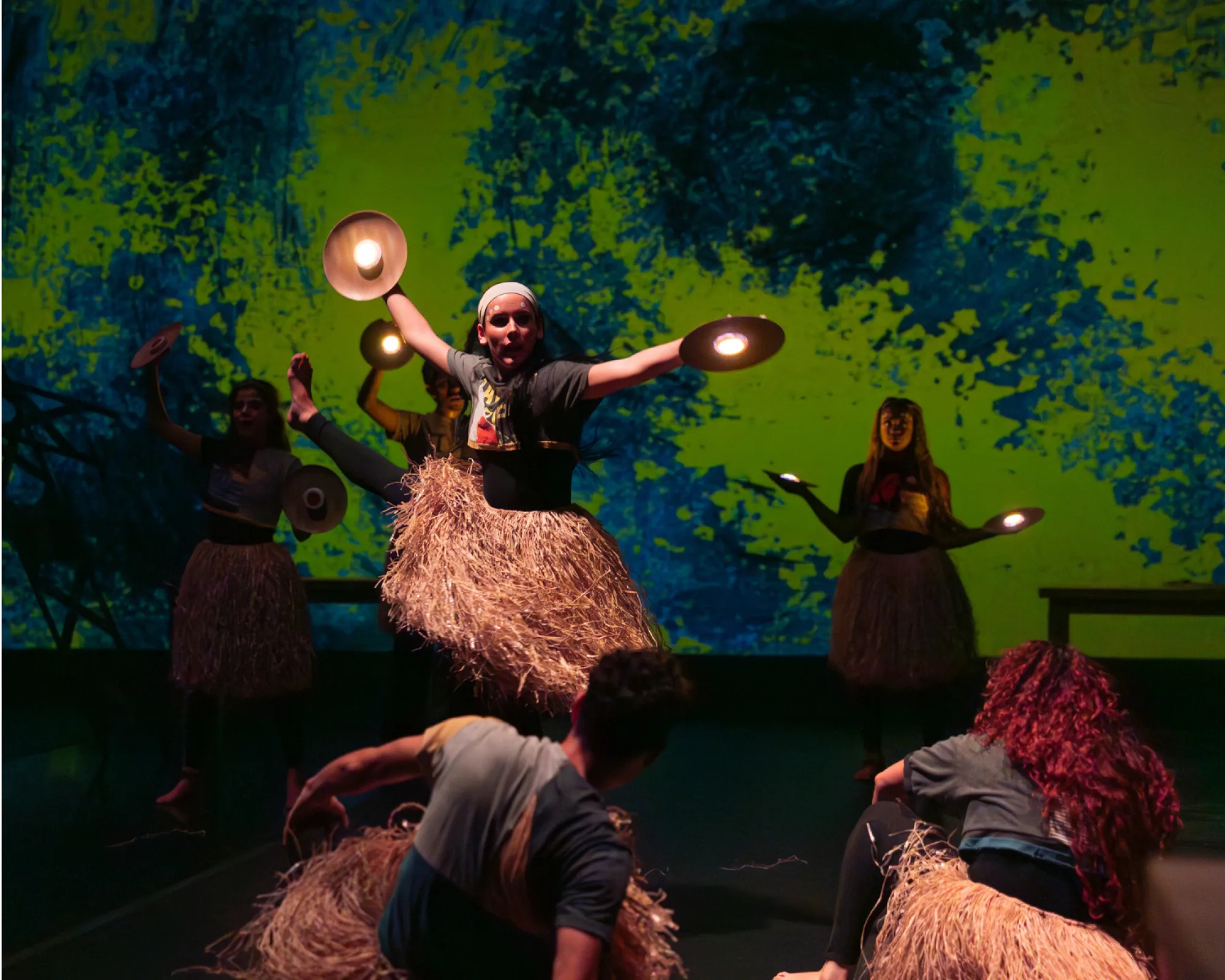 Dancers in grass skirts spinning