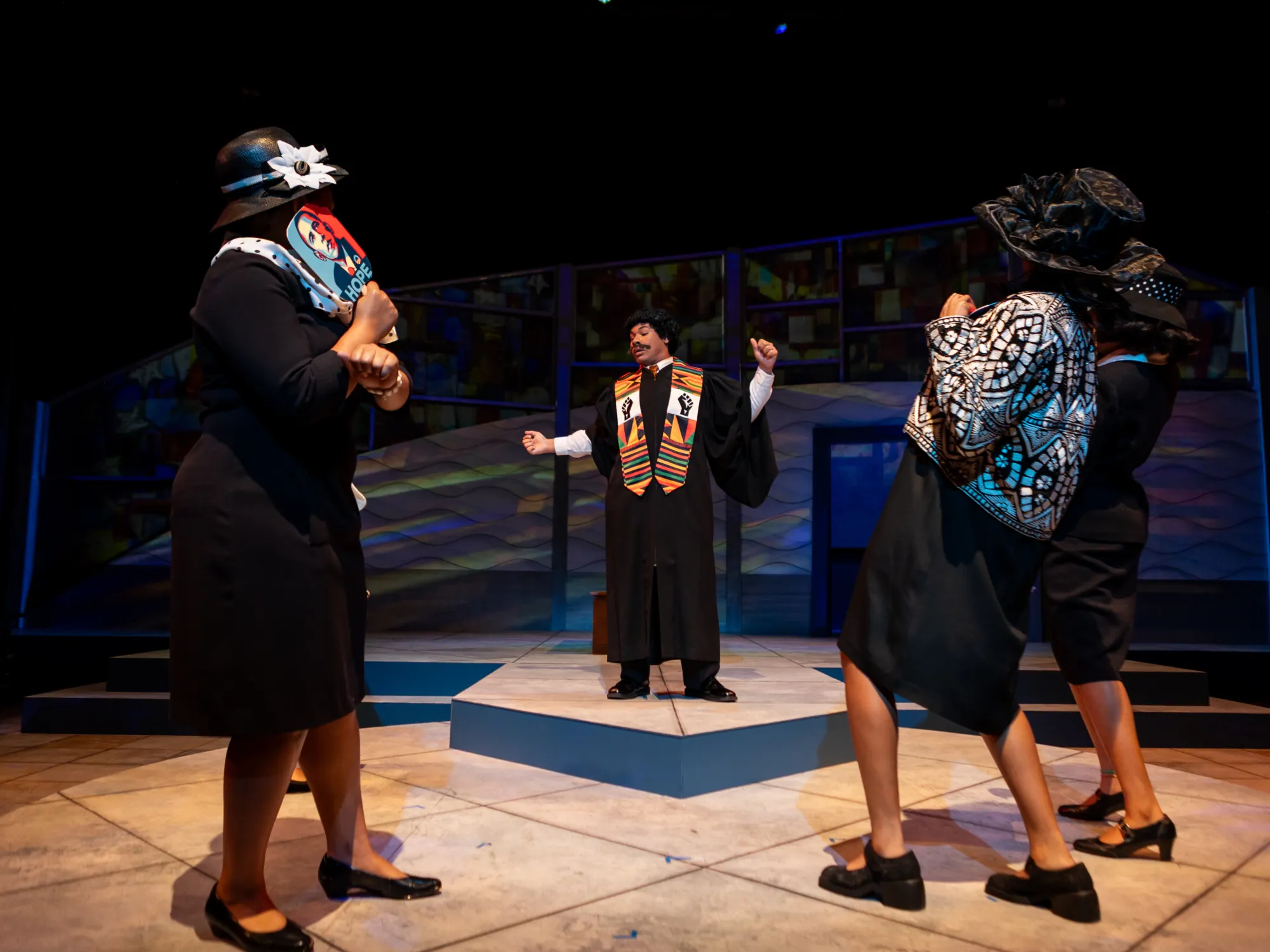 A group of actors in funeral attire