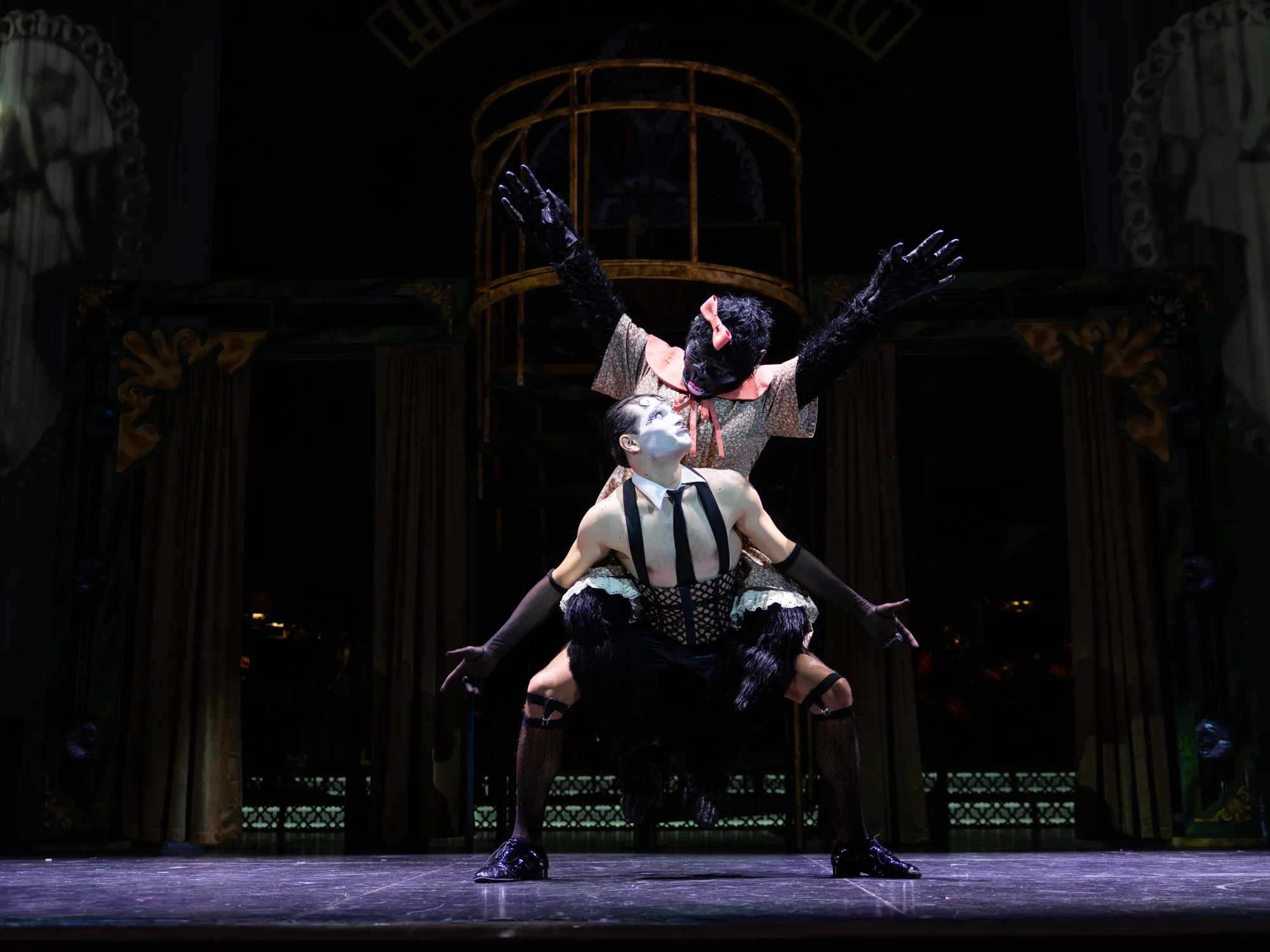 A man with a gorilla on his back