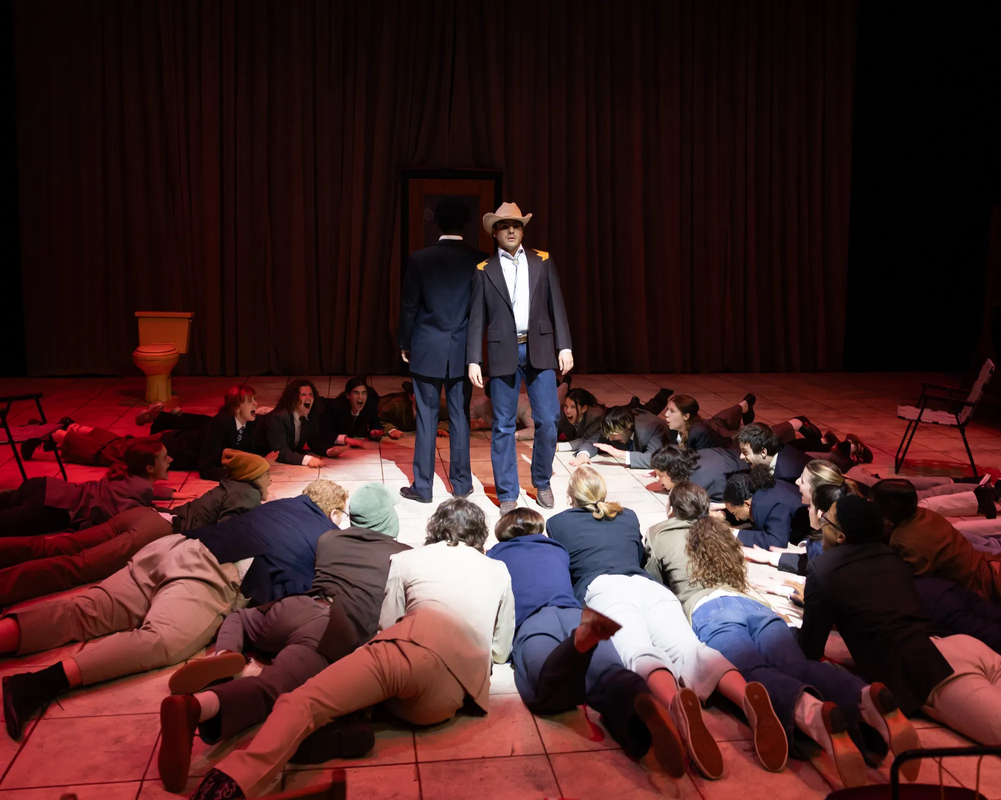 Senators lie in a circle around two men standing