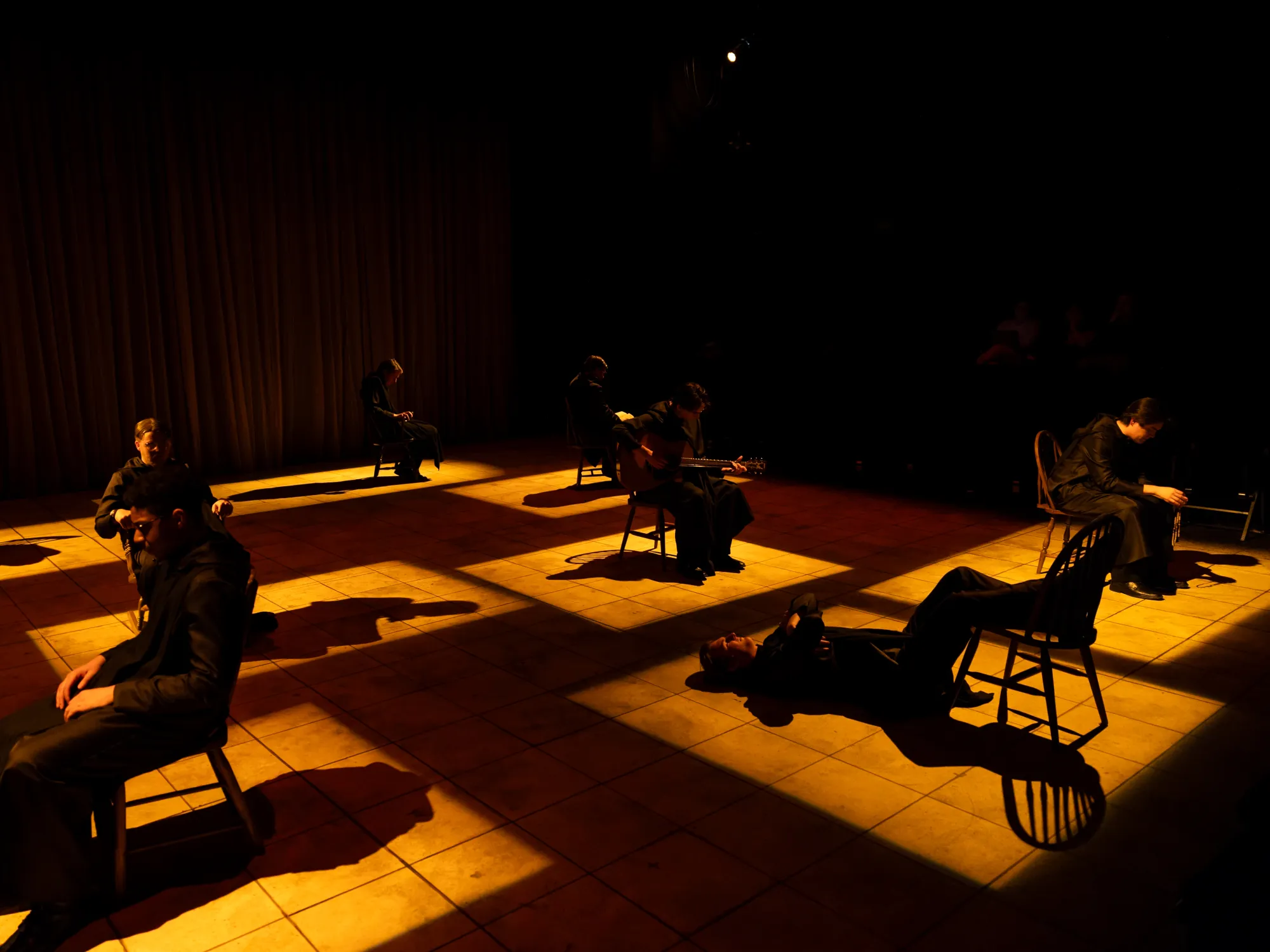 Monks sit in chairs and think