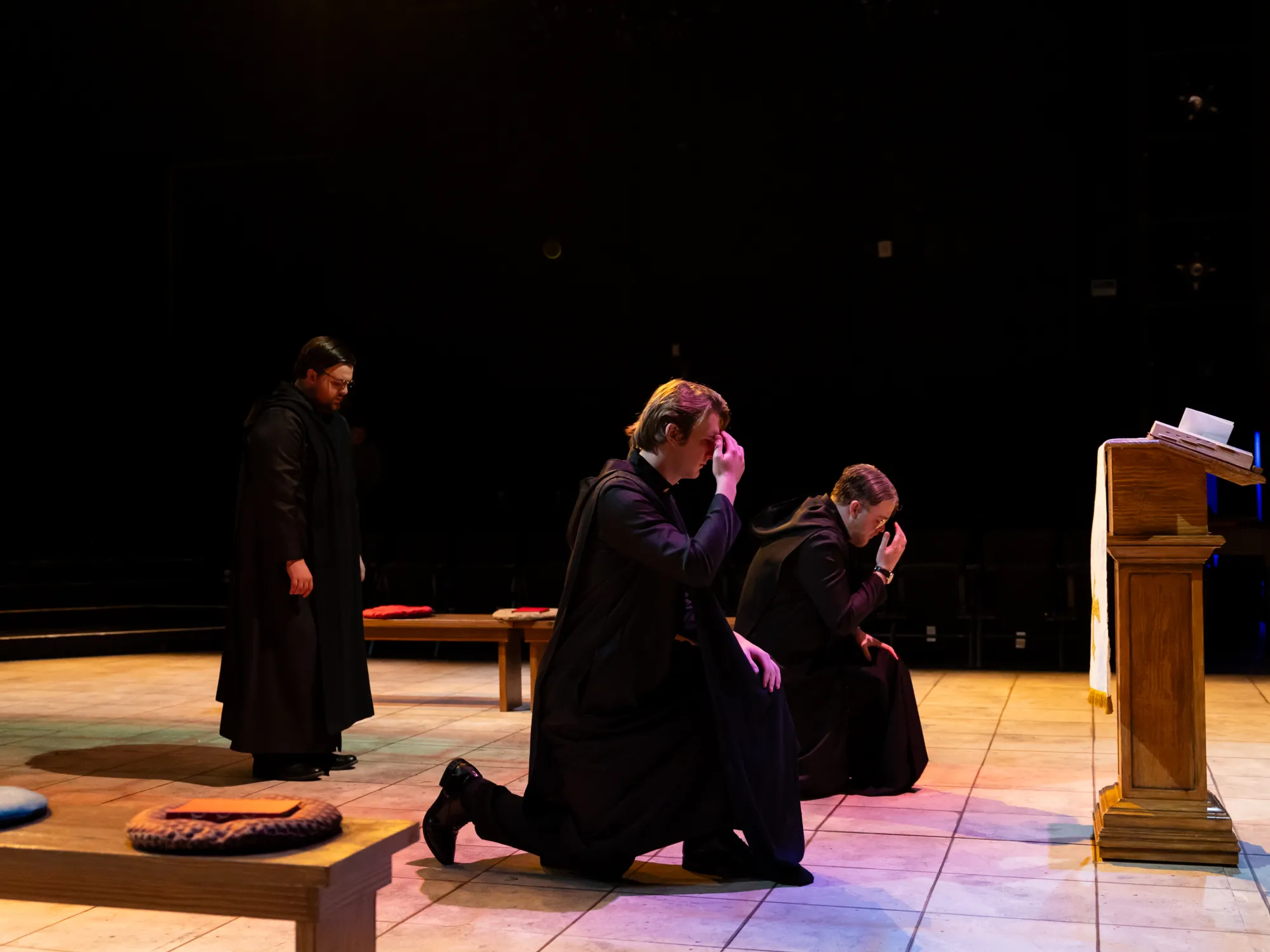 Two monks bow in prayer