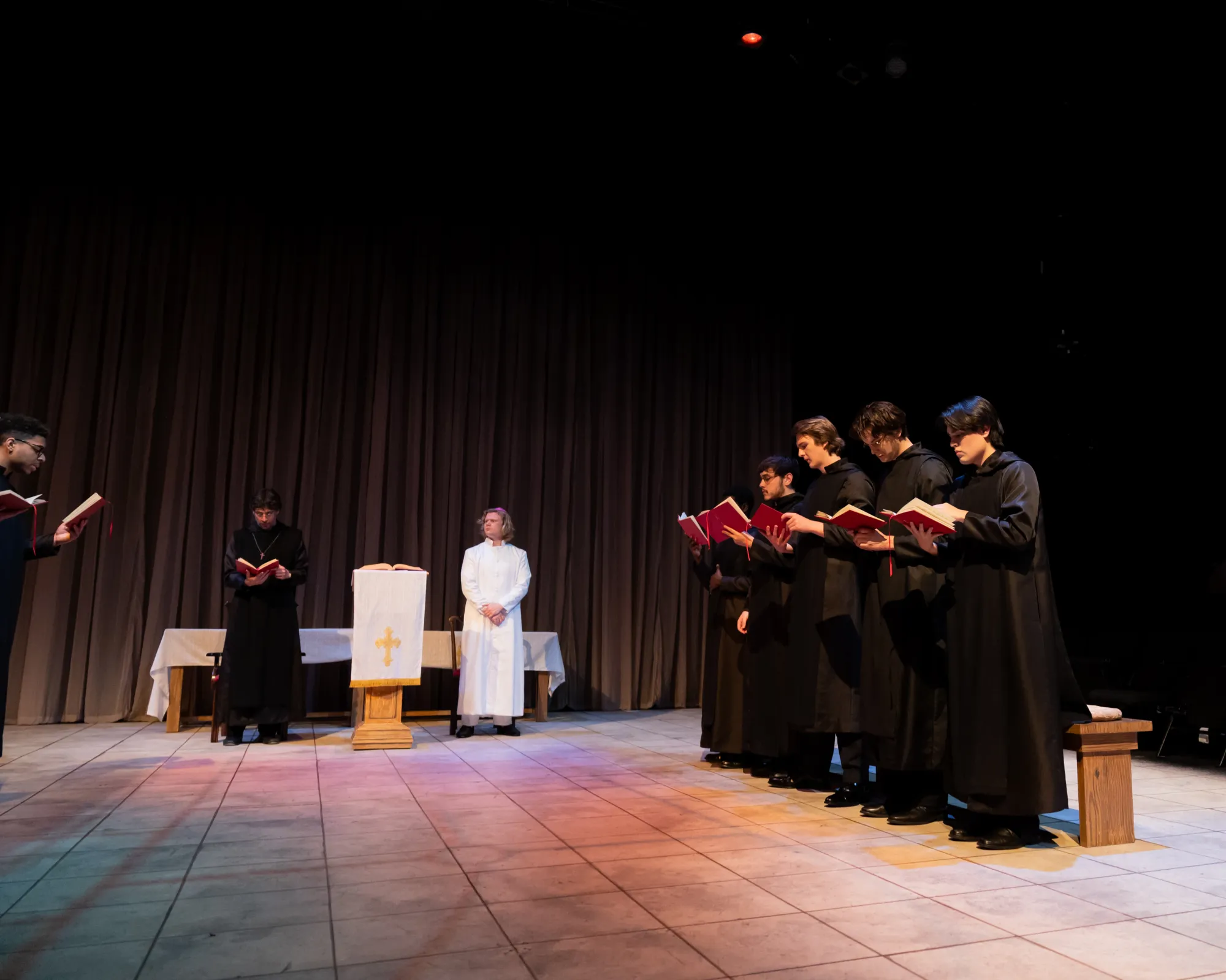 Monks stand and sing at service
