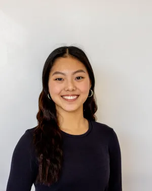 Woman with black hair and black shirt