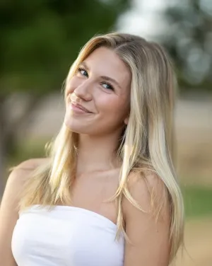 headshot of Hunter Purvis in a white strapless shirt