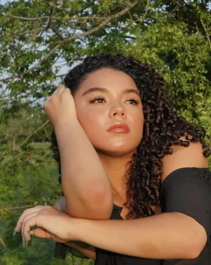 Woman with black curly hair
