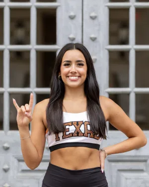 Woman with long black hair and Texas top
