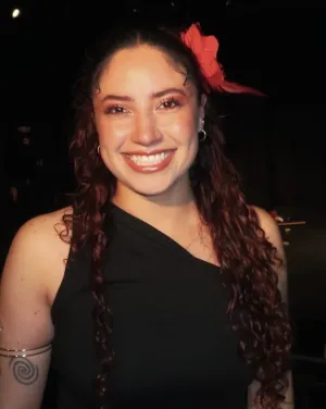 A woman with a red flower in her hair