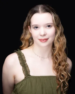 A woman with long curly hair