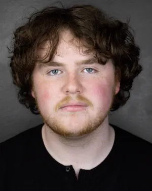 A man with curly hair