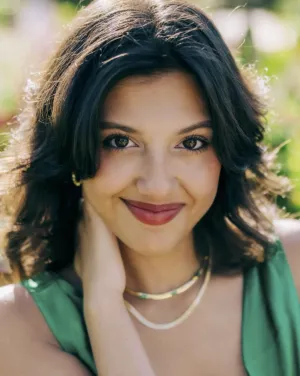 A woman in a green blouse