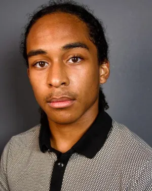 A man in a gray collared shirt