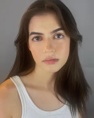 A woman with brown hair and eyes