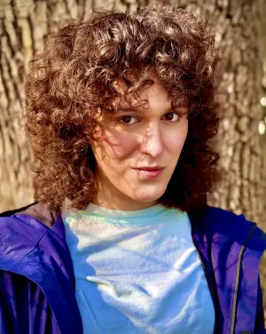 A woman wearing a blue jacket