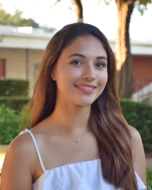 A woman with brown hair smiling