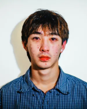 A man in a blue collared shirt