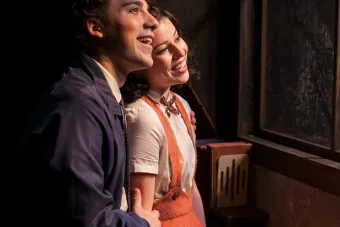 Peter Van Daan and Anne Frank at window