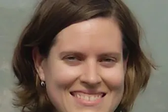 woman with short brown hair smiling