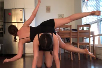 dancers posing in their kitchen