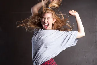 woman jumping with pony tail 