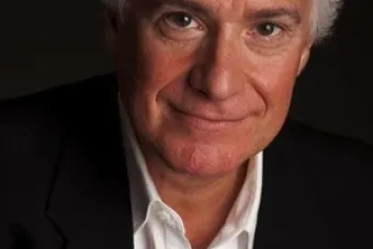 Smiling Man in front of black background