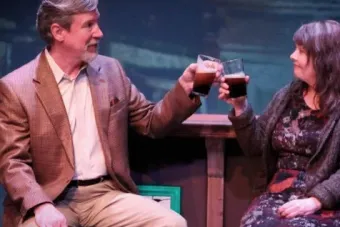 two people sharing a drink