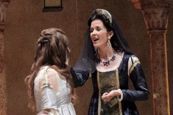woman in shakespearean clothes speaking with another woman 