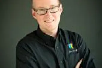 Man in glasses standing 