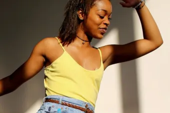 headshot dancer with arm up in studio