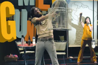 Man holding a bird cage