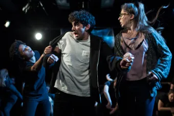 A couple runs from the reach of a zombie