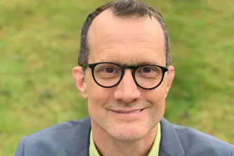 Headshot for dance scholar, choreographer, administrator and newly appointed chair of the Department of Theatre and Dance, Peter Carpenter