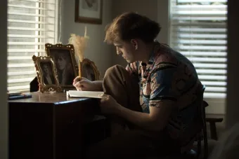 A production still from the short film GOING DARK WITH EARNEST SWEETGRASS: OR A COMPREHENSIVE GUIDE ON HOW TO DIE