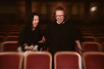 Photo of Kimberly Belflower and Danya Taymor screaming in theatre seats
