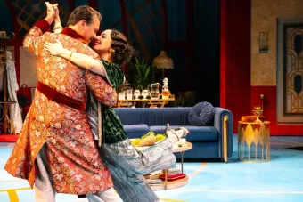 Photo of two leads of private lives at alley theatre dancing on stage