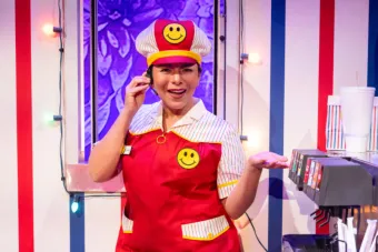 photo of a woman in a red fasts food uniform