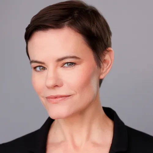 Headshot of Christin Davis in a black blazer