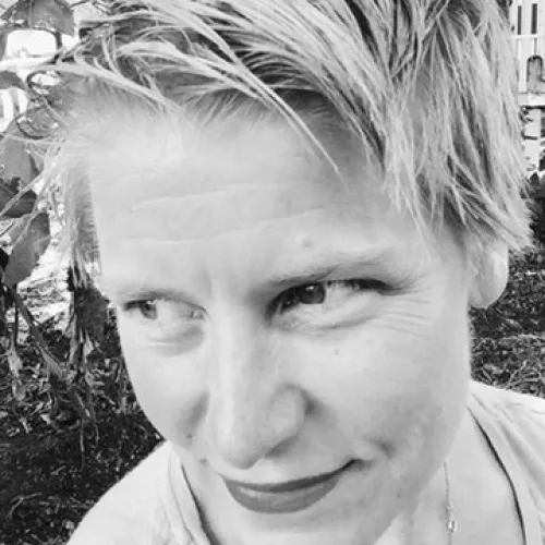 black and white headshot of a woman with short blonde hair