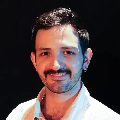 A man with short brown hair and a mustache