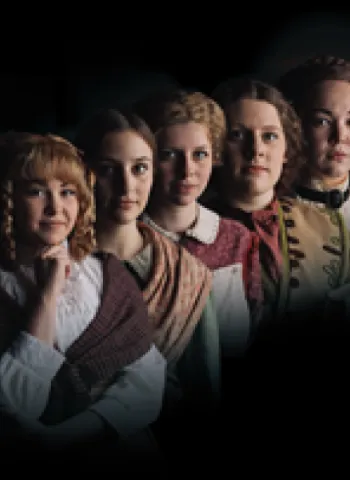 women in a row in period dresses