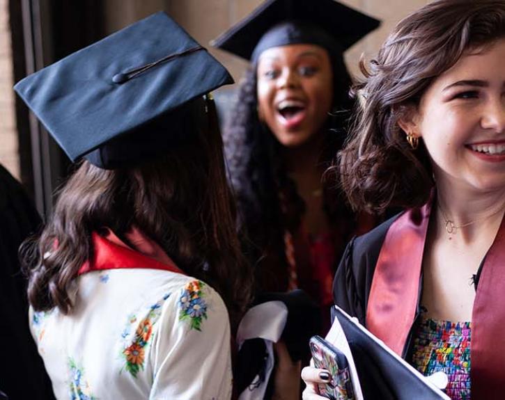 Graduates wearing regalia; UT Austin